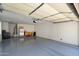 Spacious two-car garage with painted floor and storage at 19777 N 76Th St # 1106, Scottsdale, AZ 85255
