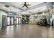 Spacious gym with multiple ceiling fans, recessed lighting, workout equipment, and floor to ceiling mirrors at 19777 N 76Th St # 1106, Scottsdale, AZ 85255