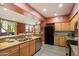 Bright kitchen featuring granite countertops, stainless steel appliances, and tile flooring at 19777 N 76Th St # 1106, Scottsdale, AZ 85255