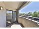 Balcony with an outside view showing palm trees and surrounding buildings at 2025 E Campbell Ave # 248, Phoenix, AZ 85016