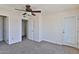 Bedroom featuring a ceiling fan, closet, and access to a private balcony at 2025 E Campbell Ave # 248, Phoenix, AZ 85016