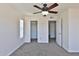 Bedroom featuring closet space, a window, and access to the bathroom at 2025 E Campbell Ave # 248, Phoenix, AZ 85016