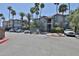 Attractive exterior with mature palm trees, meticulous landscaping, and plenty of resident parking spaces at 2025 E Campbell Ave # 248, Phoenix, AZ 85016
