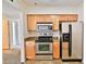 Well-equipped kitchen featuring stainless steel appliances and plenty of wood cabinetry at 2025 E Campbell Ave # 248, Phoenix, AZ 85016