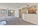 Spacious living area with balcony access and open flow to the kitchen, filled with natural light at 2025 E Campbell Ave # 248, Phoenix, AZ 85016