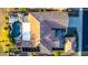 Aerial view of the property featuring a private pool, spa, patio, and meticulously landscaped yard at 20558 N 263Rd Dr, Buckeye, AZ 85396
