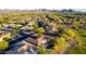 Gorgeous desert homes with red tile roofs create a beautiful community near mountains and a golf course at 20558 N 263Rd Dr, Buckeye, AZ 85396