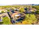Aerial view of backyard with private pool, spa, covered patio and desert landscaping at 20558 N 263Rd Dr, Buckeye, AZ 85396