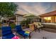 Inviting backyard features patio seating, a built-in grill, and a hot tub, great for outdoor enjoyment at 20558 N 263Rd Dr, Buckeye, AZ 85396