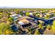 Aerial view of private backyard with pool, covered patio, solar panels and desert landscaping in a vibrant community at 20558 N 263Rd Dr, Buckeye, AZ 85396