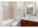 Well-lit bathroom featuring a tub-shower combo, vanity with white countertop, and modern fixtures at 20558 N 263Rd Dr, Buckeye, AZ 85396