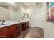 Large bathroom with double sinks, vanity area, and tiled floors providing a clean aesthetic at 20558 N 263Rd Dr, Buckeye, AZ 85396