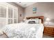 Bedroom with natural light shining through shuttered windows at 20558 N 263Rd Dr, Buckeye, AZ 85396