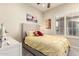Cozy bedroom with a ceiling fan and ample natural light from shuttered windows at 20558 N 263Rd Dr, Buckeye, AZ 85396