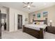 Comfortable bedroom with a large bed, neutral walls, and en suite bathroom access at 20558 N 263Rd Dr, Buckeye, AZ 85396