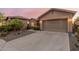Well-maintained home featuring a spacious three car garage and desert landscaping at 20558 N 263Rd Dr, Buckeye, AZ 85396