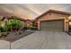 Home exterior featuring desert landscaping, a two car garage, and paver driveway at 20558 N 263Rd Dr, Buckeye, AZ 85396