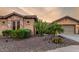 Desert landscaping highlights this charming single Gathering home with a two car garage at 20558 N 263Rd Dr, Buckeye, AZ 85396