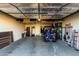 Spacious garage with ample storage shelves and room for golf equipment and a refrigerator at 20558 N 263Rd Dr, Buckeye, AZ 85396