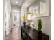 Hallway features decorative console table, mirror, and a view into the adjacent bedroom at 20558 N 263Rd Dr, Buckeye, AZ 85396