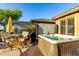 Backyard with hot tub, bar, and seating: the perfect place to relax and entertain guests at 20558 N 263Rd Dr, Buckeye, AZ 85396