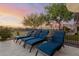 Relax in style on the patio with comfortable lounge chairs and scenic views of the golf course at 20558 N 263Rd Dr, Buckeye, AZ 85396