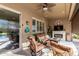 Inviting outdoor patio with comfortable seating, a ceiling fan, and a view of the pool area at 20558 N 263Rd Dr, Buckeye, AZ 85396