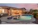 Beautiful pool area with a built-in hot tub and outdoor seating, perfect for entertaining or relaxation at 20558 N 263Rd Dr, Buckeye, AZ 85396
