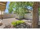 The backyard features a small patch of artificial turf and a white shed for extra storage at 2407 W Rue De Lamour Ave, Phoenix, AZ 85029