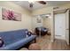 This bedroom boasts a sliding mirror closet, wood floors, and contemporary artwork to create a relaxing and modern space at 2407 W Rue De Lamour Ave, Phoenix, AZ 85029
