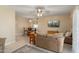 Cozy living area with comfortable sofa, pendant light, and views of dining area at 2407 W Rue De Lamour Ave, Phoenix, AZ 85029