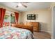 Comfortable bedroom with a television and a sliding door to patio at 2407 W Rue De Lamour Ave, Phoenix, AZ 85029