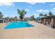 This community pool has plenty of room to swim or relax with shade from the sun under blue canopies at 2407 W Rue De Lamour Ave, Phoenix, AZ 85029