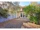 Private backyard with desert landscaping, block fence, wood deck and mature trees at 250 W Juniper Ave # 22, Gilbert, AZ 85233