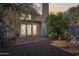 Charming backyard features a wooden deck, mature trees, and double doors leading indoors at 250 W Juniper Ave # 22, Gilbert, AZ 85233
