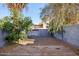 Private backyard with desert landscaping, block fence, and a wood deck at 250 W Juniper Ave # 22, Gilbert, AZ 85233
