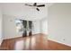 Bedroom with wood floors and large windows with gray curtains at 250 W Juniper Ave # 22, Gilbert, AZ 85233