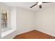 Empty bedroom boasts laminate floors, and large window at 250 W Juniper Ave # 22, Gilbert, AZ 85233
