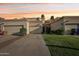 Inviting home featuring desert landscaping, multiple garages, and a private drive at 250 W Juniper Ave # 22, Gilbert, AZ 85233
