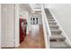 Hallway with stairs and laundry area at 250 W Juniper Ave # 22, Gilbert, AZ 85233