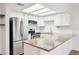 Bright kitchen with stainless steel appliances and granite countertops at 250 W Juniper Ave # 22, Gilbert, AZ 85233