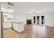 Bright kitchen boasts granite countertops, white cabinetry, stainless steel appliances, and open concept living area at 250 W Juniper Ave # 22, Gilbert, AZ 85233