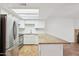 Kitchen features stainless steel appliances, granite countertops and bright white cabinetry at 250 W Juniper Ave # 22, Gilbert, AZ 85233