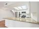 Kitchen features stainless steel appliances, granite countertops and a view of the stairs at 250 W Juniper Ave # 22, Gilbert, AZ 85233