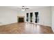 Spacious living room with tiled flooring, fireplace, and sliding doors leading to the patio at 250 W Juniper Ave # 22, Gilbert, AZ 85233