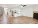 Open-concept living space with kitchen view, featuring tiled floors and abundant natural light at 250 W Juniper Ave # 22, Gilbert, AZ 85233