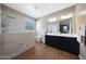 Modern bathroom with a walk-in shower, dual sinks, and stylish fixtures at 30446 W Picadilly Rd, Buckeye, AZ 85396