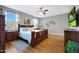 Cozy bedroom with wood furnishings, large windows, and a comfortable bed at 30446 W Picadilly Rd, Buckeye, AZ 85396