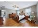 Relaxing bedroom with wood furnishings, large windows, and ample natural light at 30446 W Picadilly Rd, Buckeye, AZ 85396