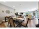 Beautiful dining room featuring a large table and chairs, open to the living room at 30446 W Picadilly Rd, Buckeye, AZ 85396